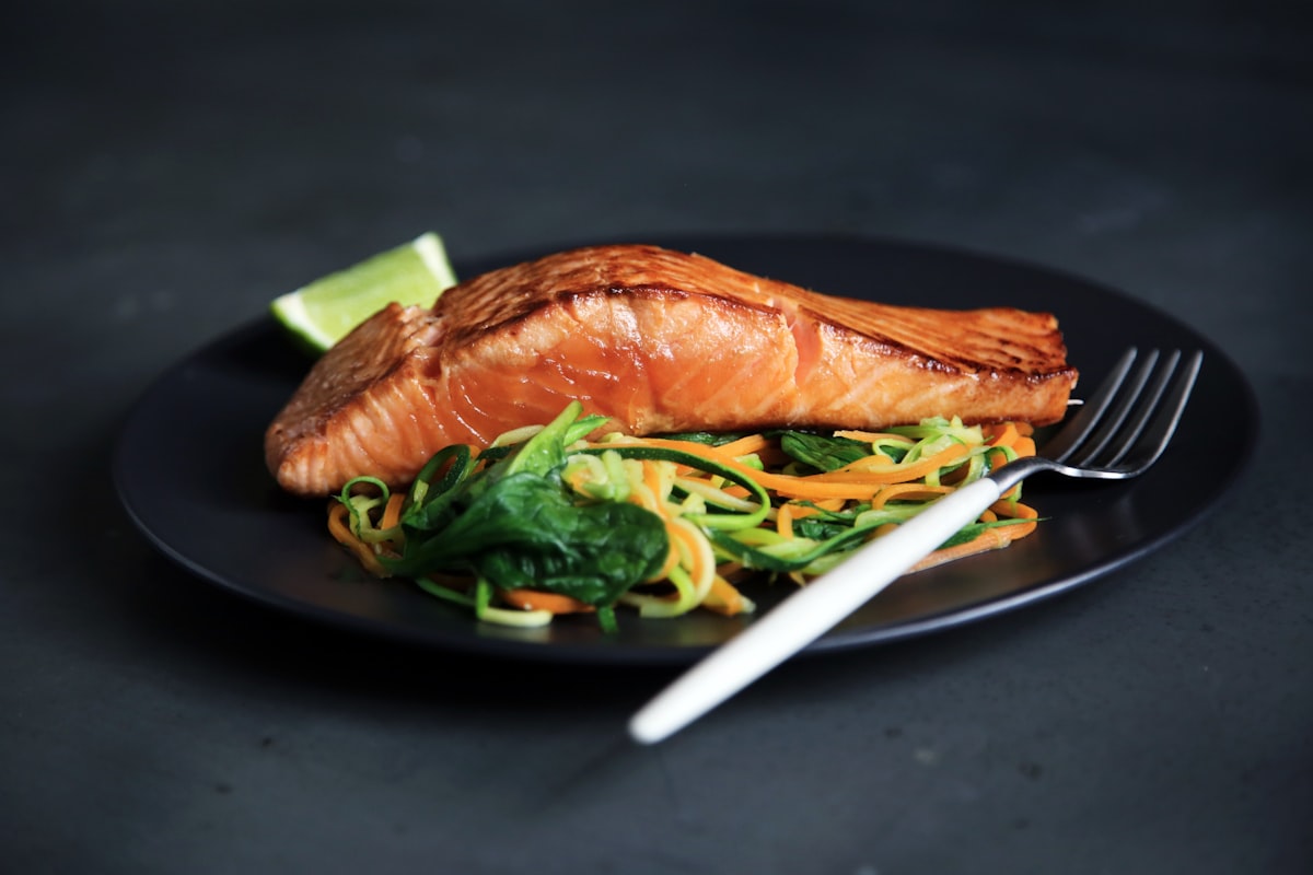 A low-carb meal of glazed salmon over spiralized zucchini noodles
